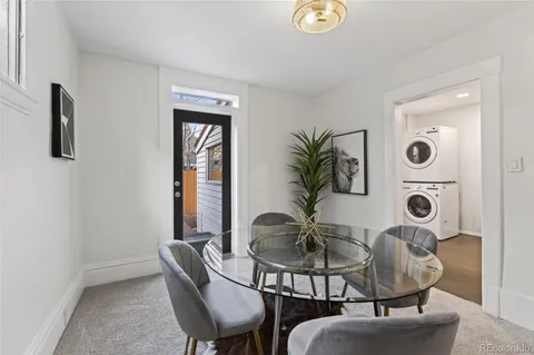 a kitchen with stainless steel appliances granite countertop a refrigerator sink and cabinets