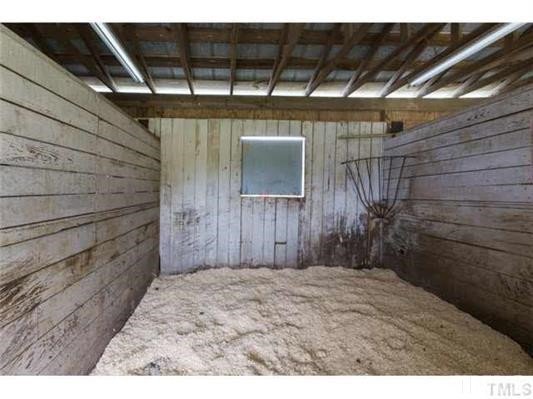 9123 South Lowell Road Bahama, NC 27503 - Photo 25 of 25 The stalls are Dutch doors and have a viewing window on the rear of each stall. A simple, but functional, barn is a shed-row style. A 5-bay 3-sided dirt-floored equipment shed is located behind the farm house. STall