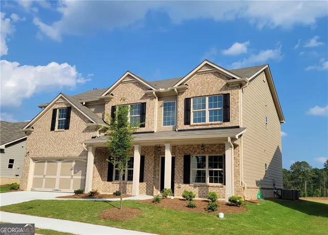 front view of a house with a yard
