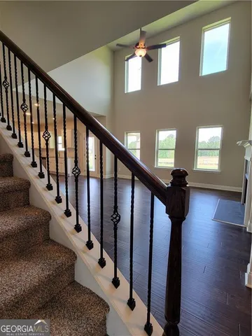 a view of entryway and hall with wooden floor