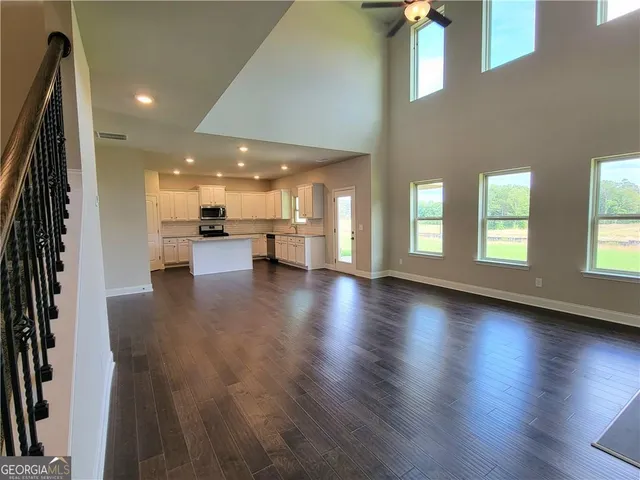 a view of an entryway with wooden floor