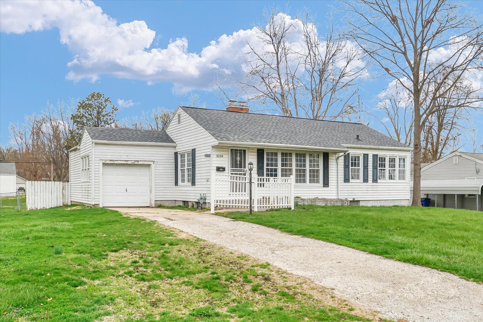 3234 East Fulton Avenue Decatur, IL 62521 - Photo 2 of 34 a big house with a big yard and more large trees