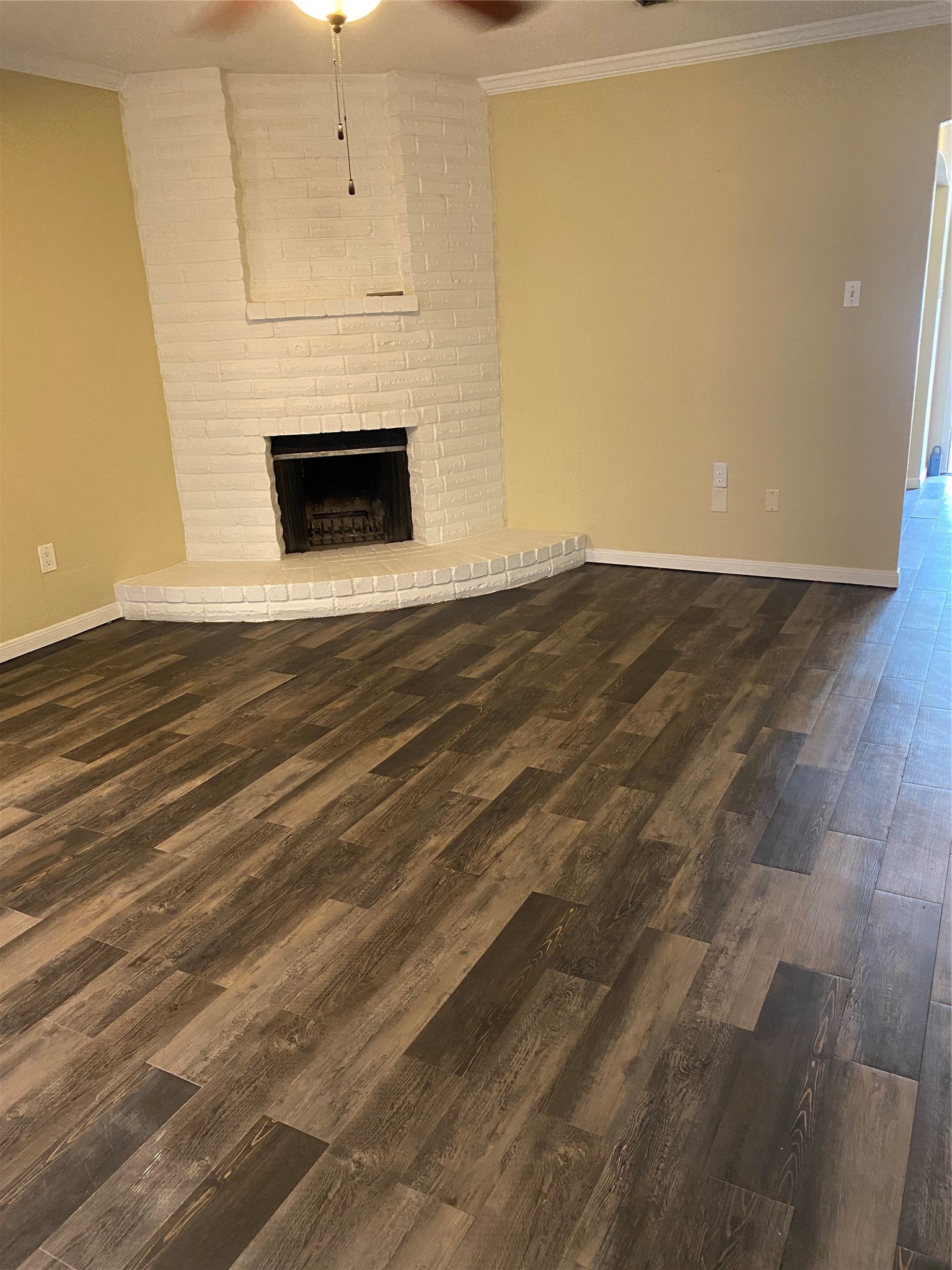415 North Forest Boulevard Houston, TX 77090 - Photo 18 of 18 a view of empty room with wooden floor and fireplace