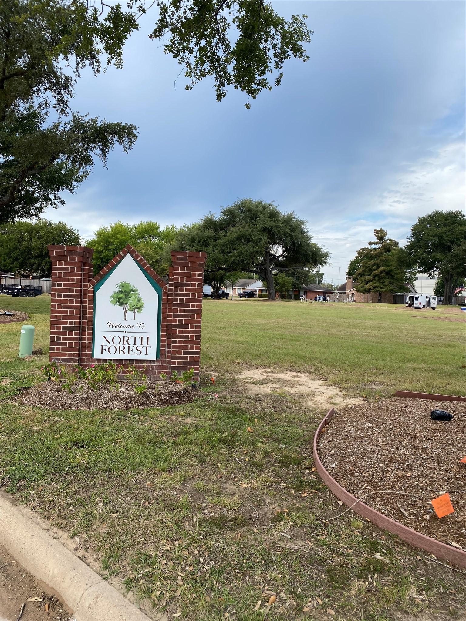 415 North Forest Boulevard Houston, TX 77090 - Photo 4 of 18 a view of a wooden house with a big yard and palm trees