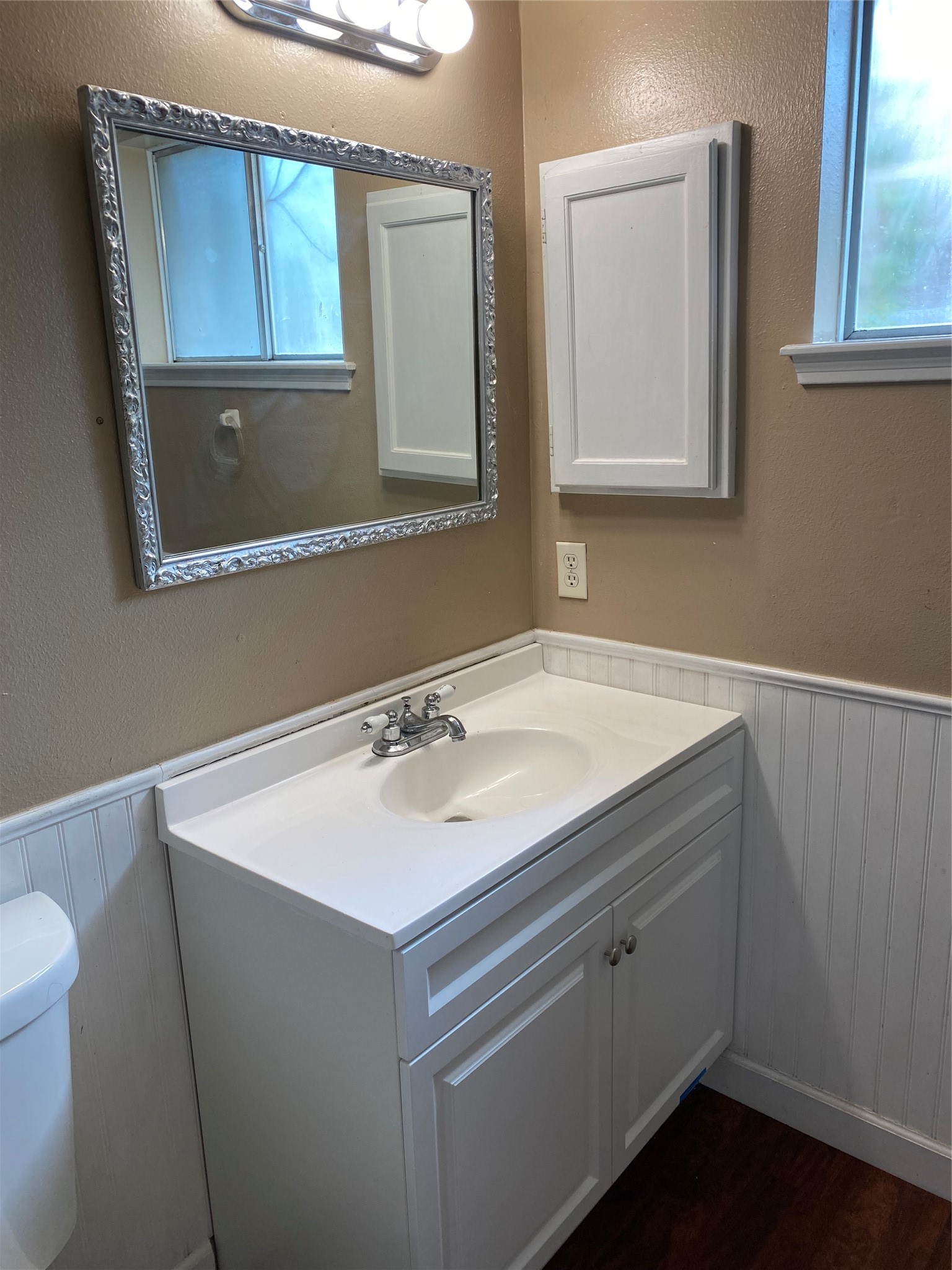 415 North Forest Boulevard Houston, TX 77090 - Photo 5 of 18 a bathroom with a sink vanity and mirror