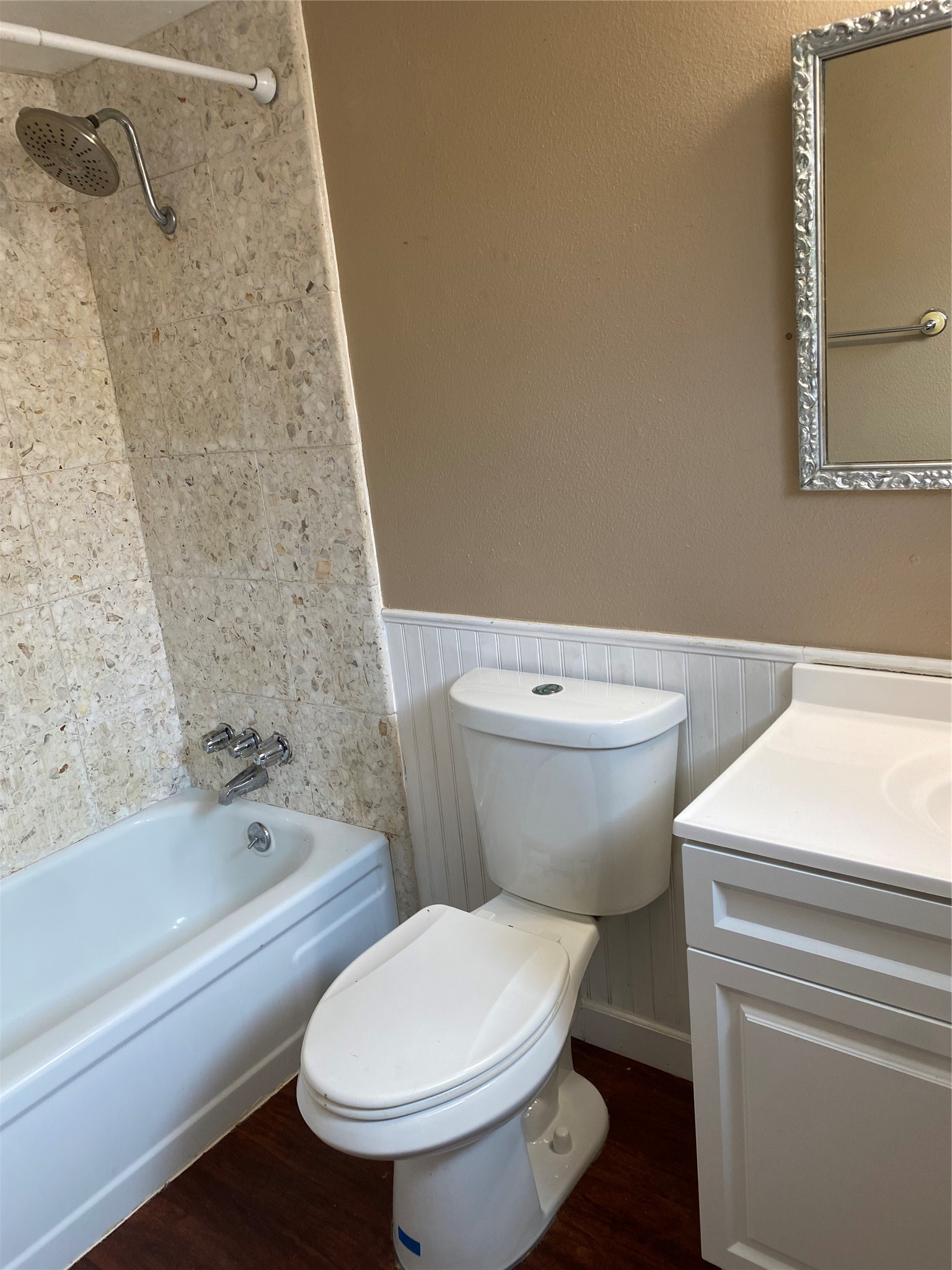415 North Forest Boulevard Houston, TX 77090 - Photo 7 of 18 a white toilet sitting next to a bath tub