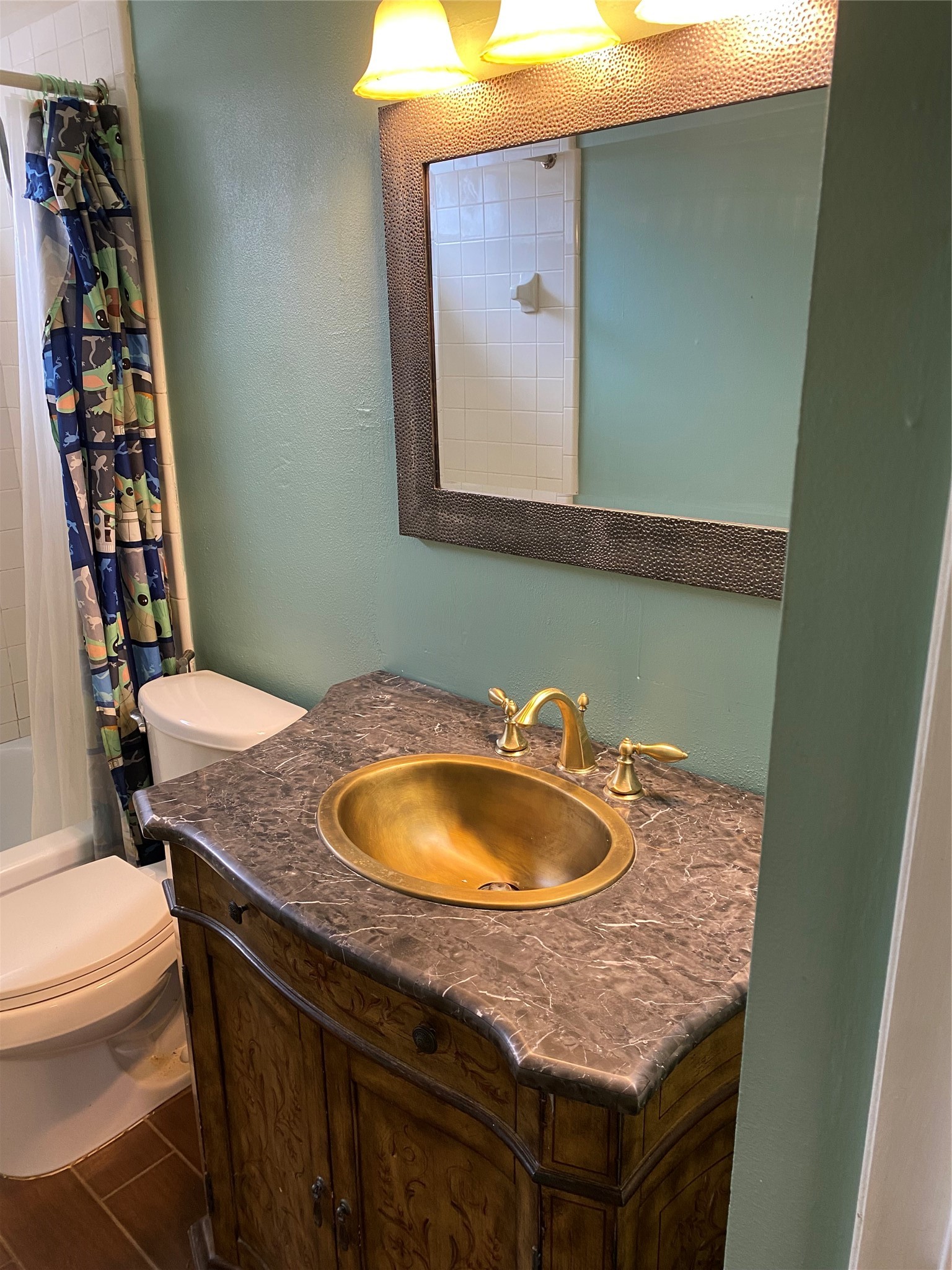 415 North Forest Boulevard Houston, TX 77090 - Photo 10 of 18 a bathroom with a granite countertop sink and a mirror