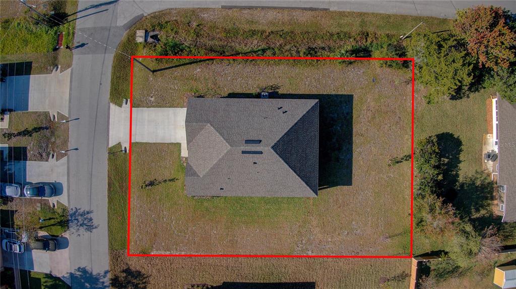 10 Freneau Lane Palm Coast, FL 32137 - Photo 24 of 29 an aerial view of a house with a yard and a large tree