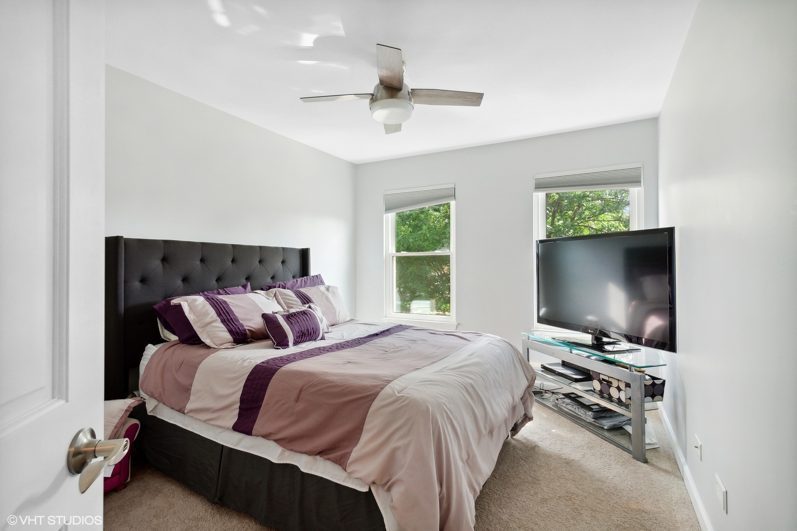 2816 Yosemite Drive Aurora, IL 60503 - Photo 11 of 18 a bedroom with a bed and a flat screen tv