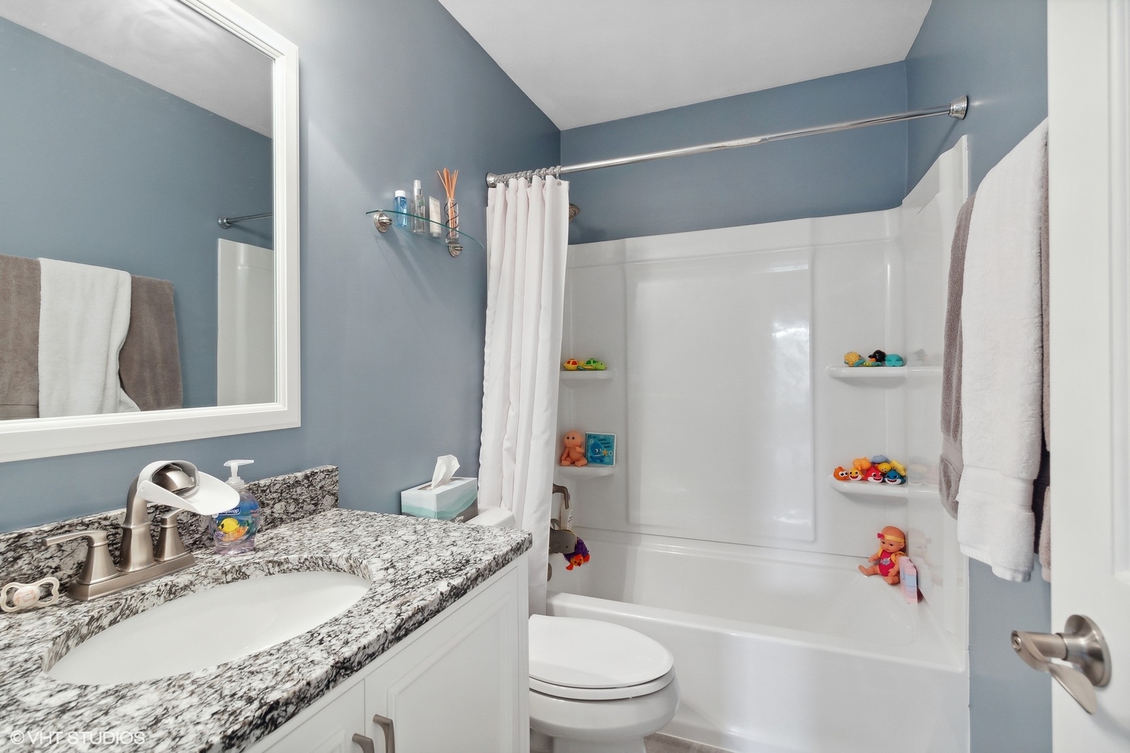 2816 Yosemite Drive Aurora, IL 60503 - Photo 12 of 18 a bathroom with a granite countertop sink toilet and shower