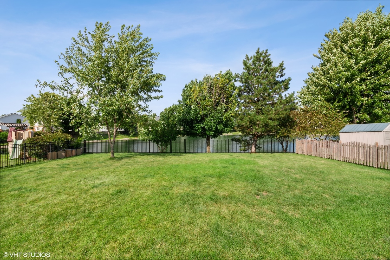 2816 Yosemite Drive Aurora, IL 60503 - Photo 14 of 18 a view of a grassy field with trees in the background
