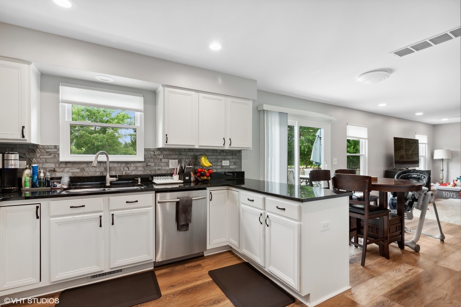 2816 Yosemite Drive Aurora, IL 60503 - Photo 3 of 18 a kitchen with appliances a sink a window and dining table
