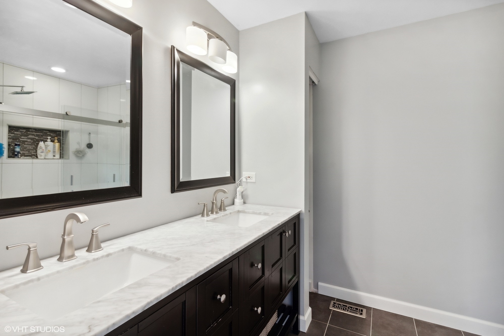 2816 Yosemite Drive Aurora, IL 60503 - Photo 8 of 18 a bathroom with a double vanity sink and a mirror