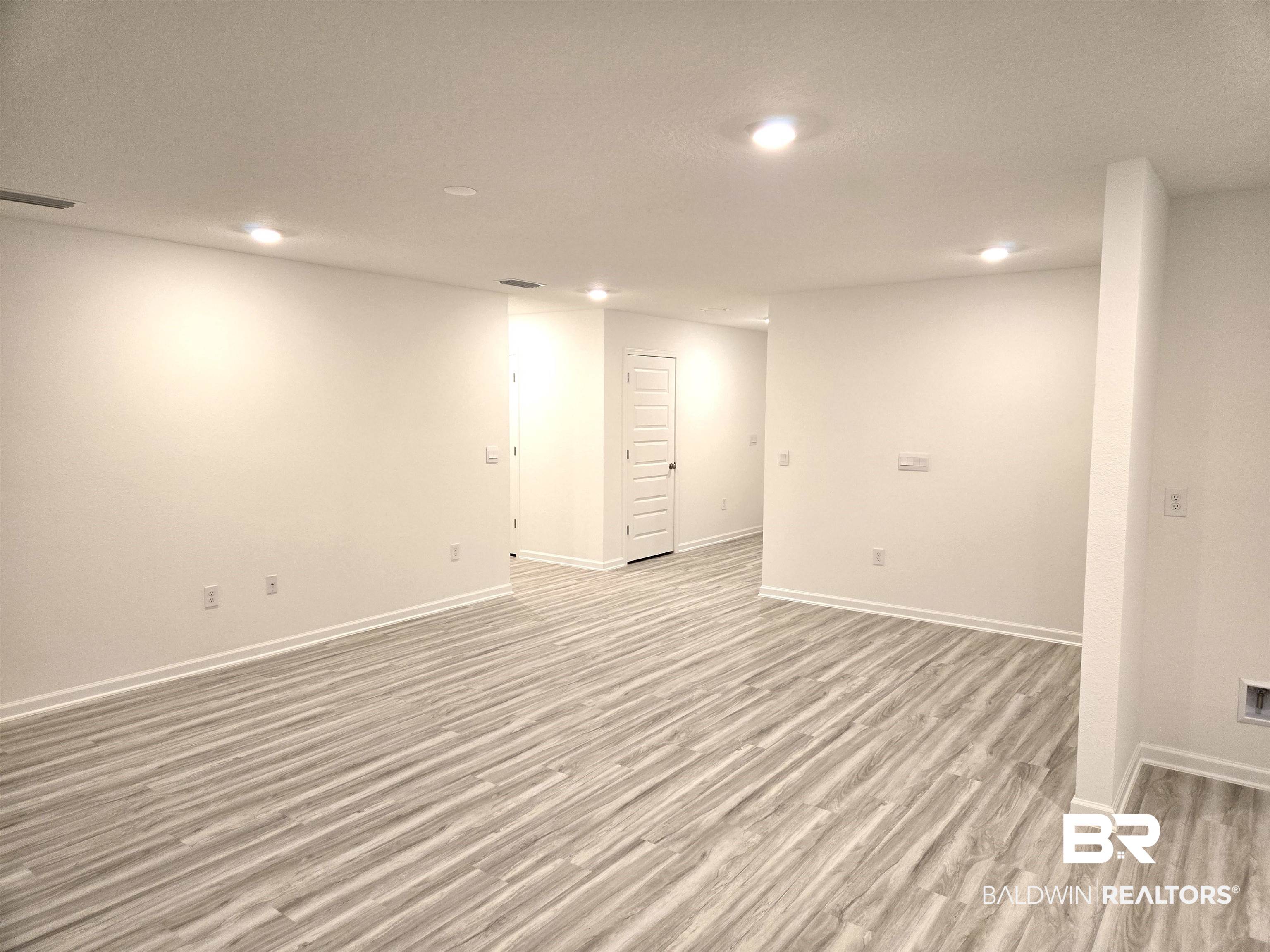 24385 Ringneck Loop Elberta, AL 36530 - Photo 10 of 33 Basement featuring light hardwood / wood-style flooring