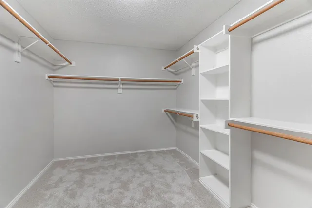 a view of storage and utility room with windows