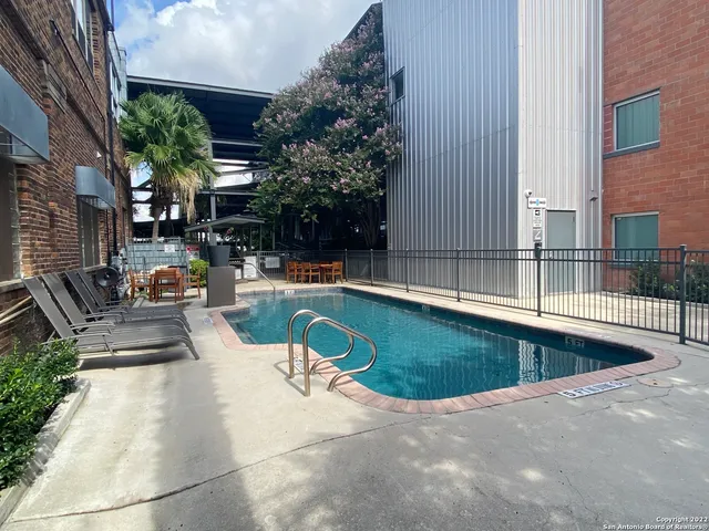 a view of a swimming pool with a patio