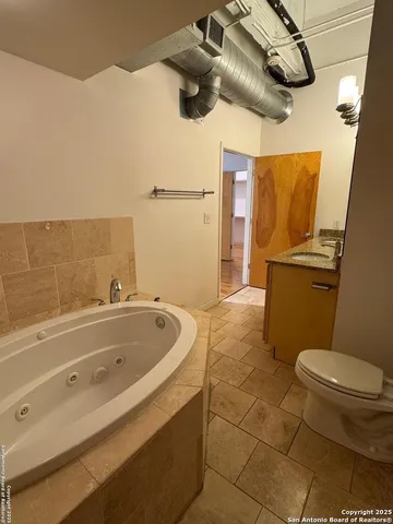 a bathroom with a sink and toilet