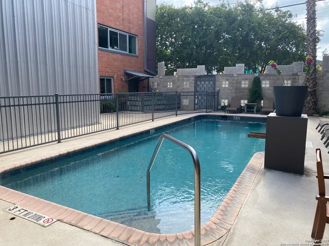 a view of a balcony with two chairs