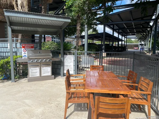 a view of a chairs and table in the patio