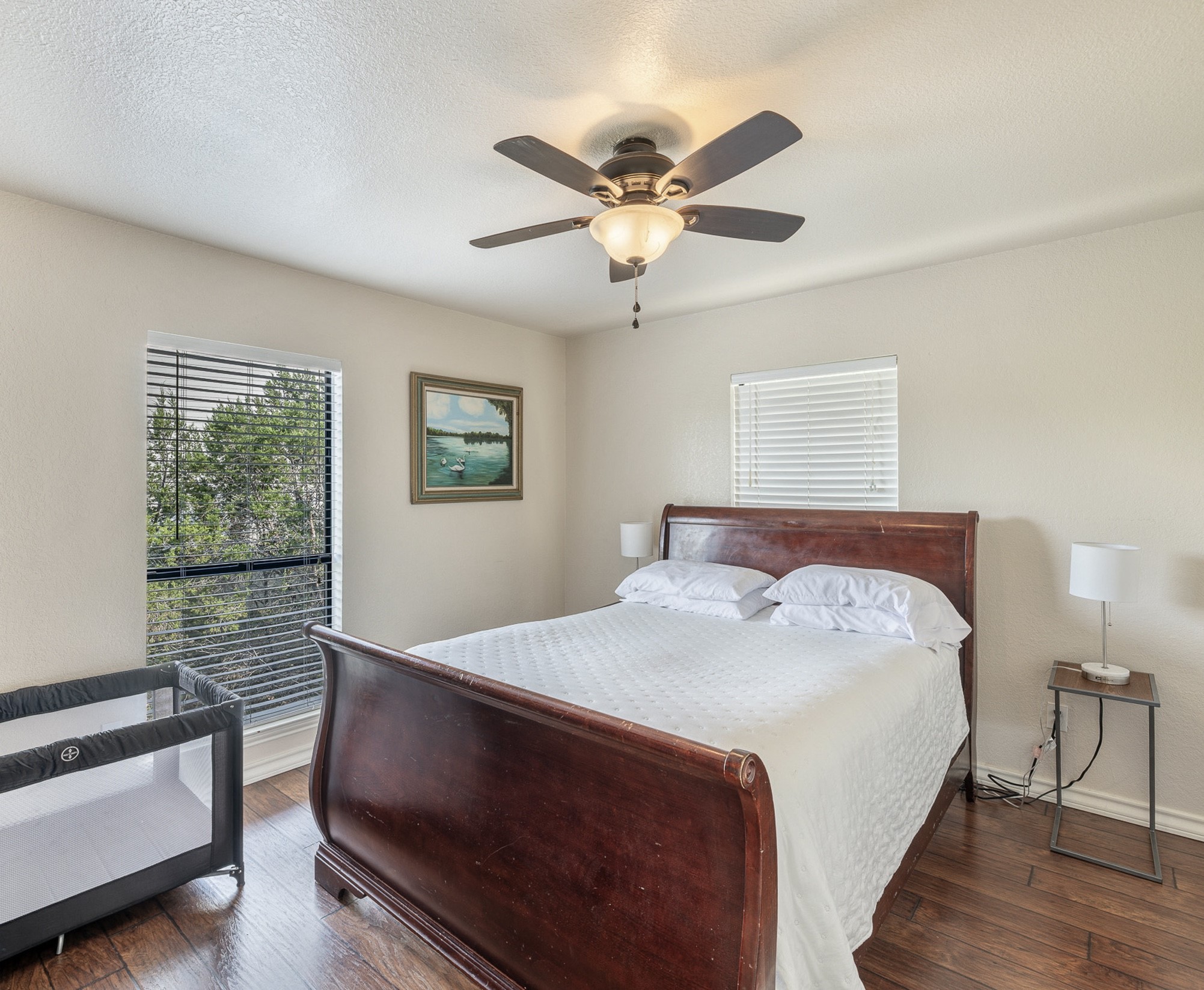 156 Lakefront Drive Point Venture, TX 78645 - Photo 21 of 37 a bedroom with a bed and a chandelier