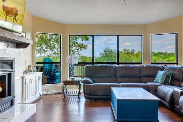 a living room with furniture and a large window
