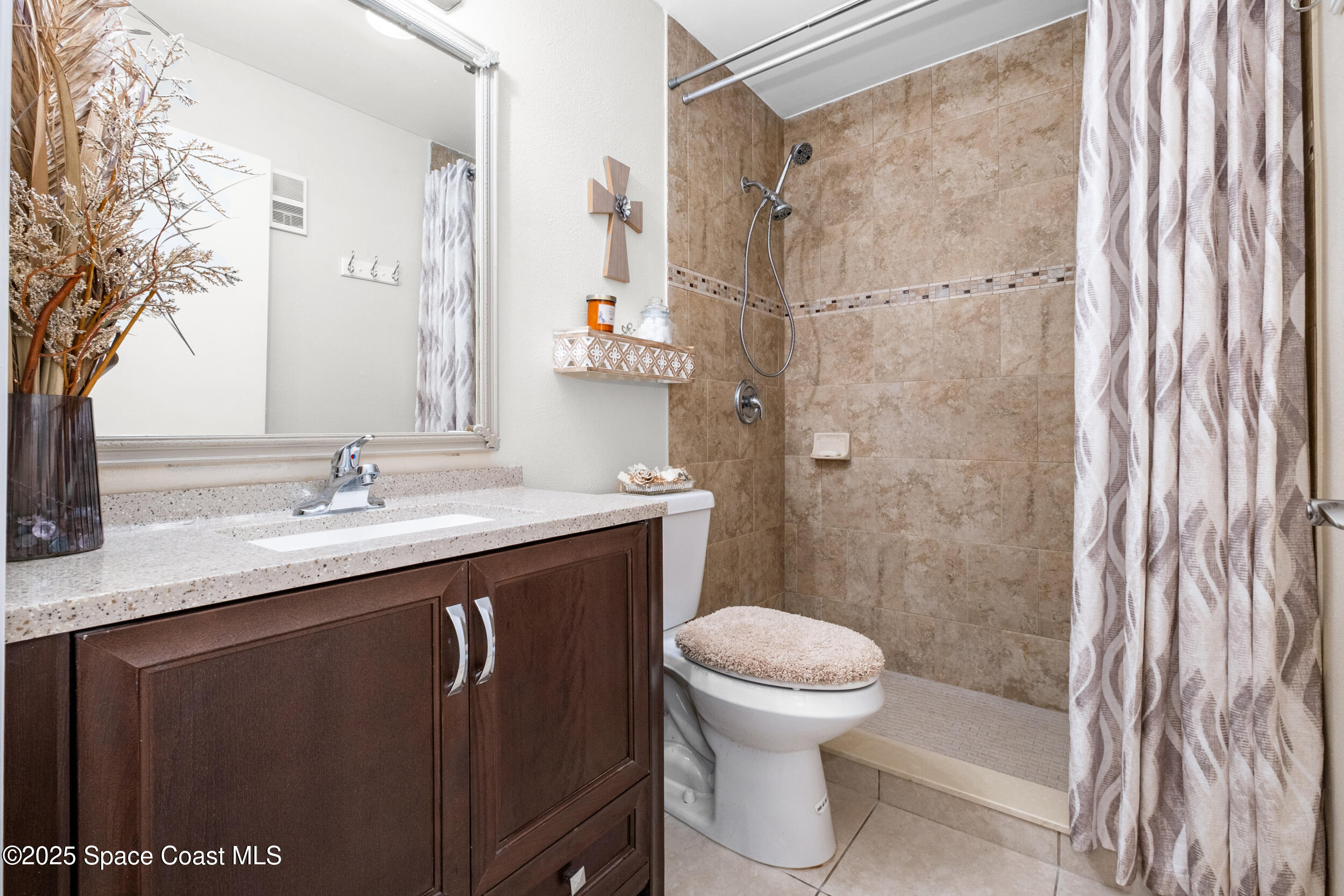 7667 North Wickham Road, Unit 302 Melbourne, FL 32940 - Photo 15 of 27 Second bath with walk in shower