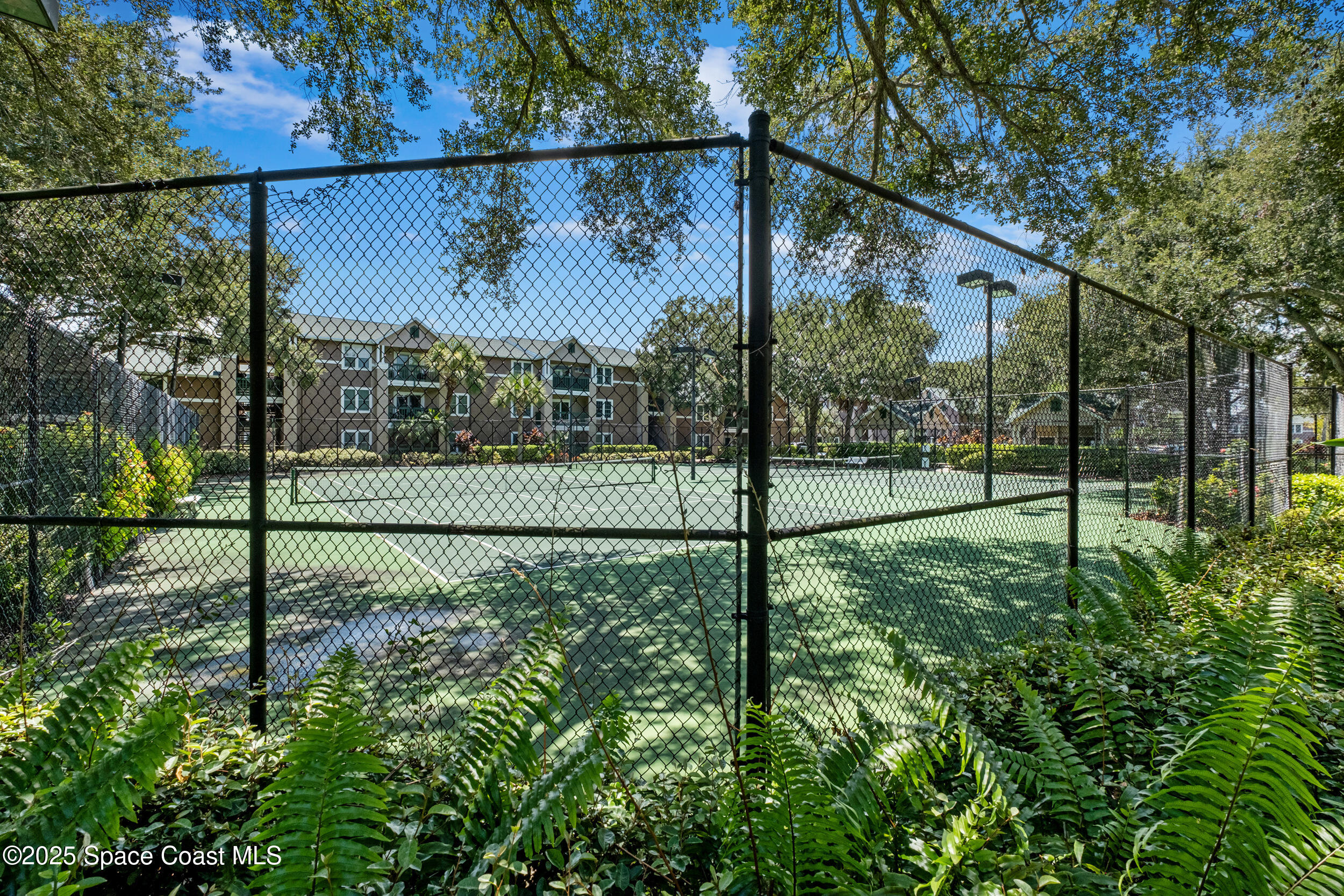 7667 North Wickham Road, Unit 302 Melbourne, FL 32940 - Photo 23 of 27 Tennis anyone?