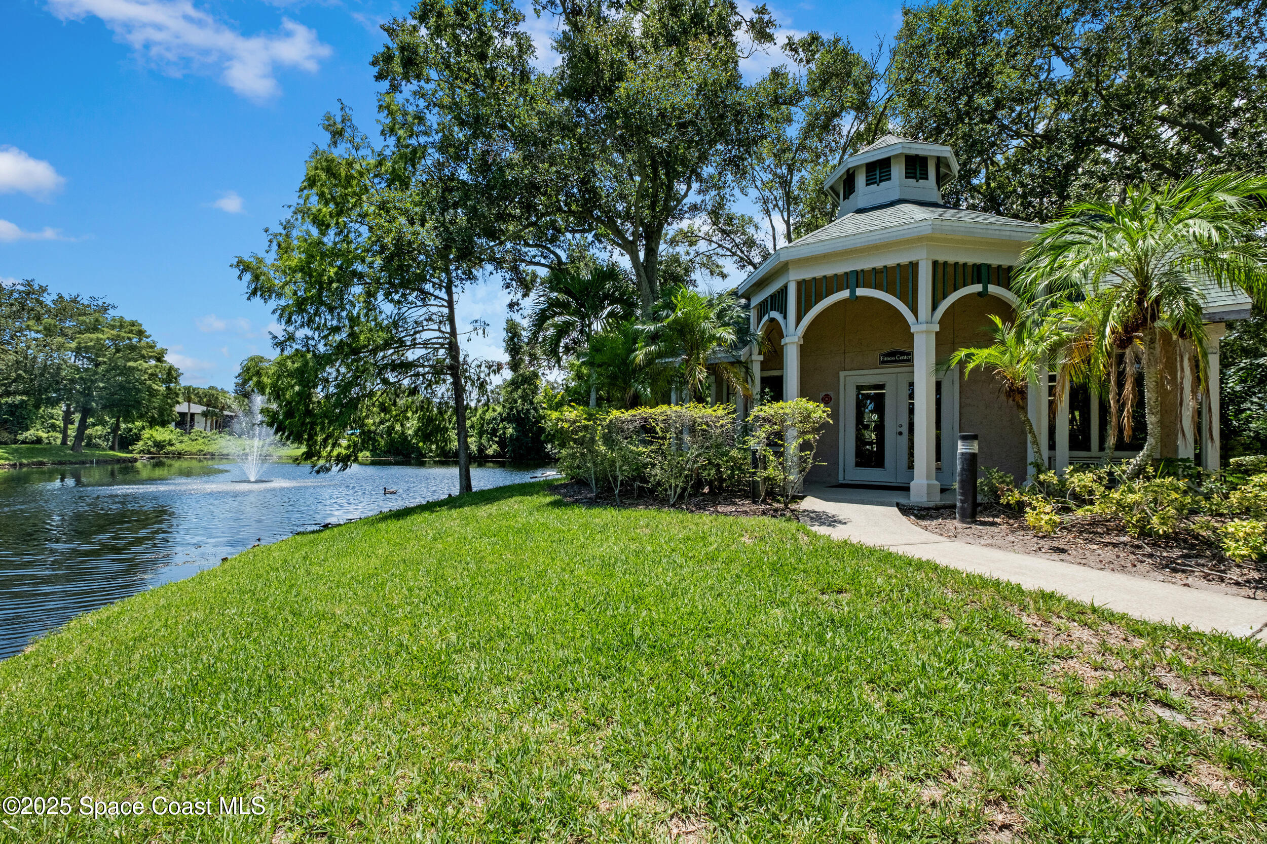 7667 North Wickham Road, Unit 302 Melbourne, FL 32940 - Photo 25 of 27 A pond too