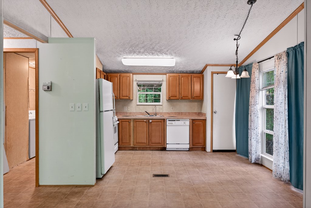 282 West Cherry Road Hayesville, NC 28904 - Photo 6 of 45 a view of a kitchen with a refrigerator and a sink