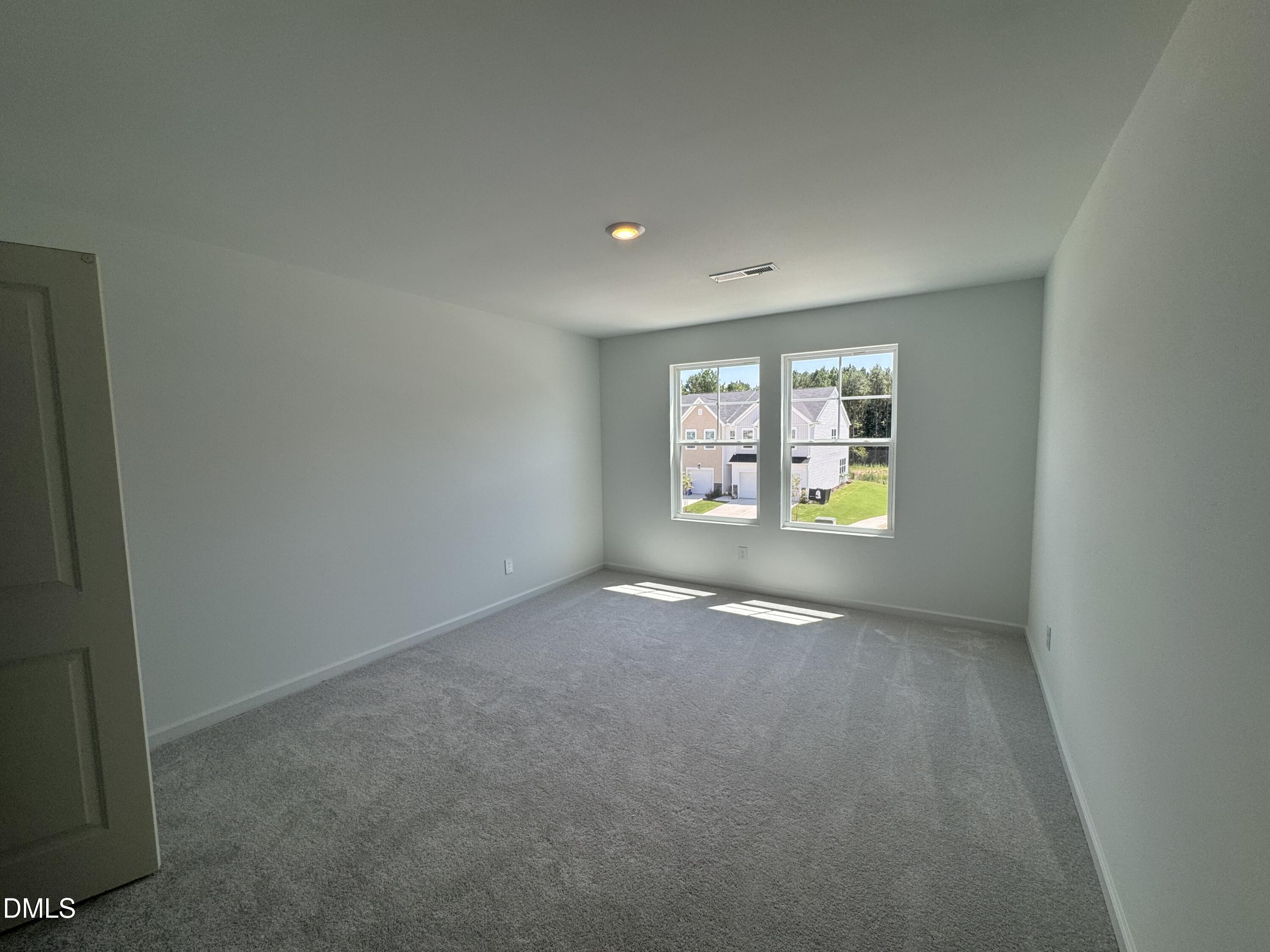 300 Thompson Overlook Way Smithfield, NC 27577 - Photo 11 of 41 an empty room with windows