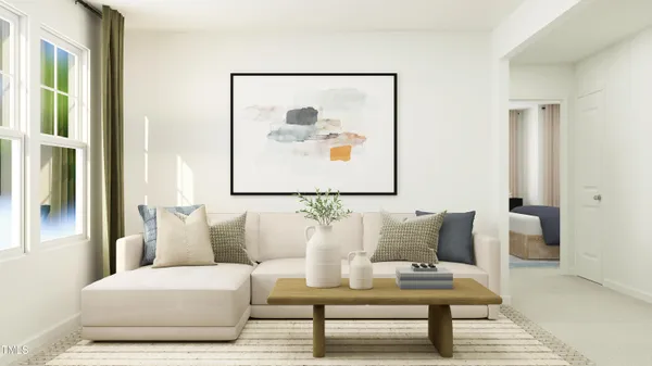 a living room with furniture and a painting