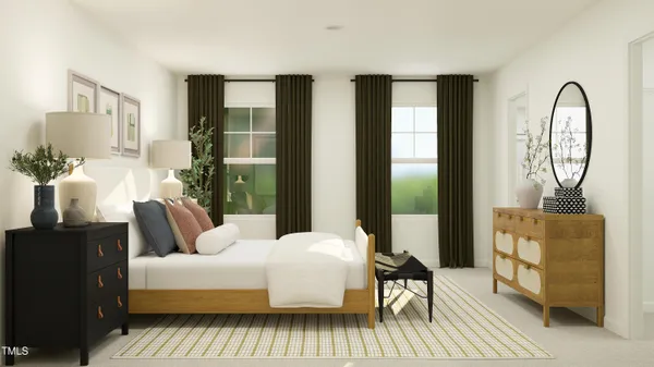 a bedroom with a bed couch and a window