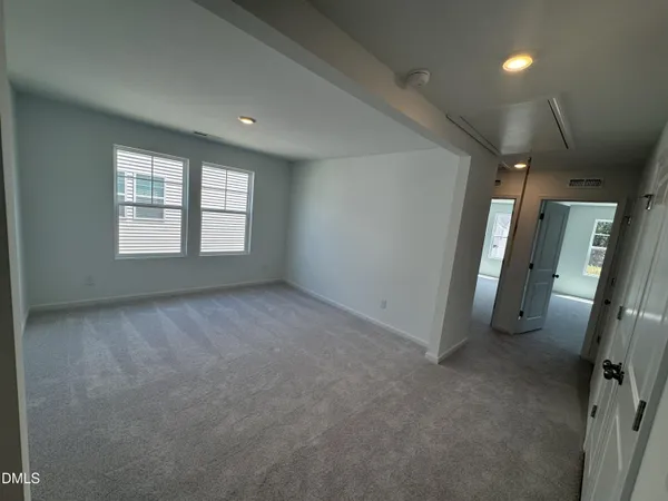 a view of an empty room and a windows