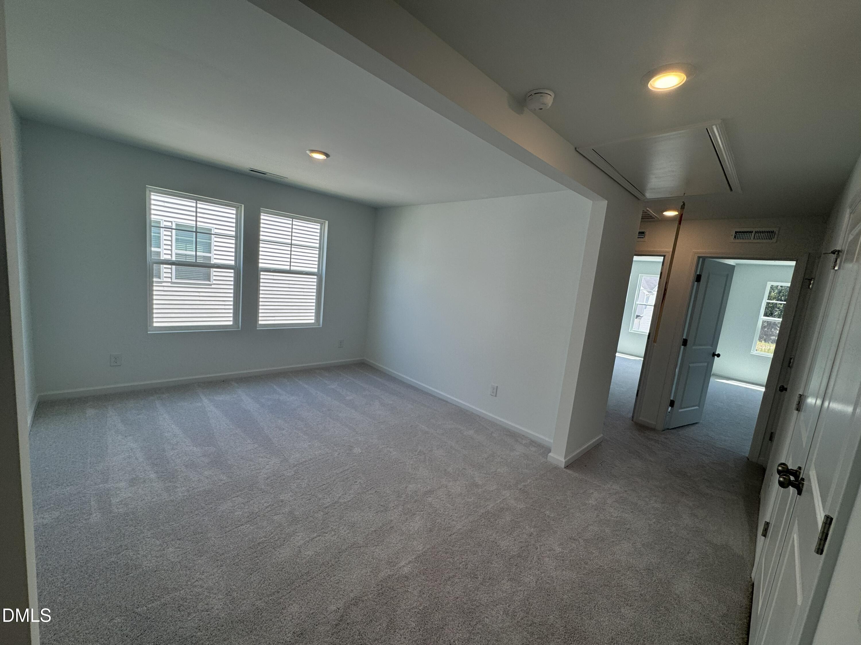 300 Thompson Overlook Way Smithfield, NC 27577 - Photo 6 of 41 a view of an empty room and a windows