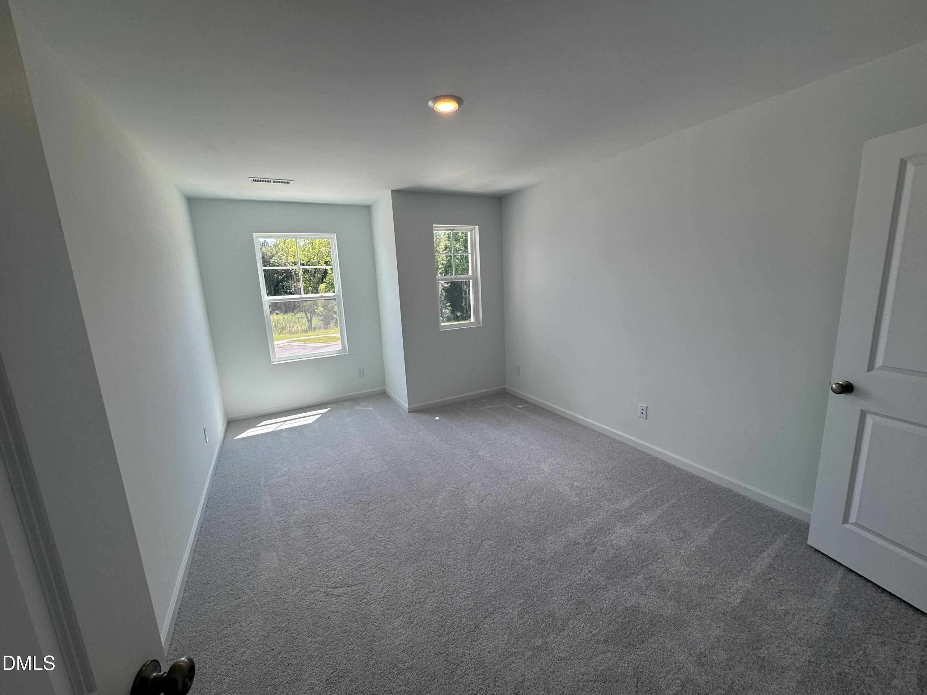 300 Thompson Overlook Way Smithfield, NC 27577 - Photo 8 of 41 an empty room with windows