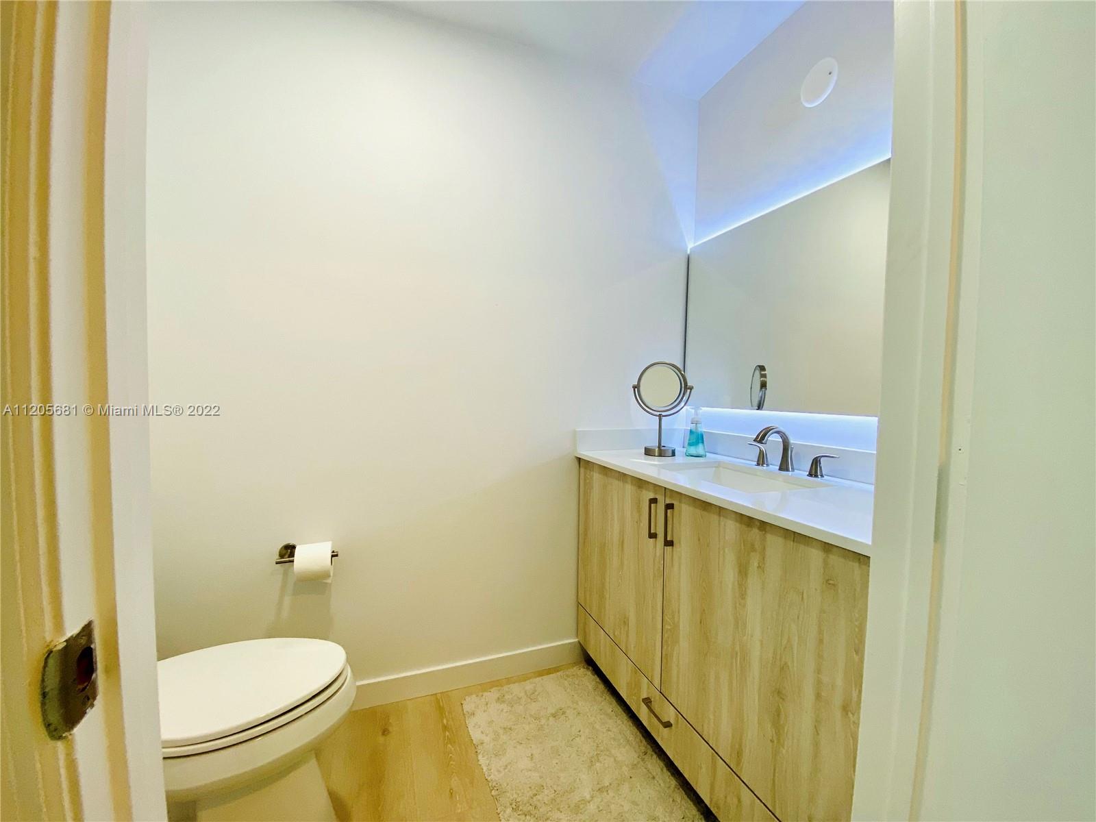 60 Southwest 13th Street, Unit 1412 Miami, FL 33130 - Photo 7 of 39 a bathroom with a sink and a toilet