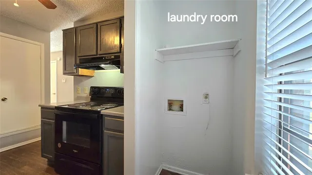a kitchen with a refrigerator and a stove