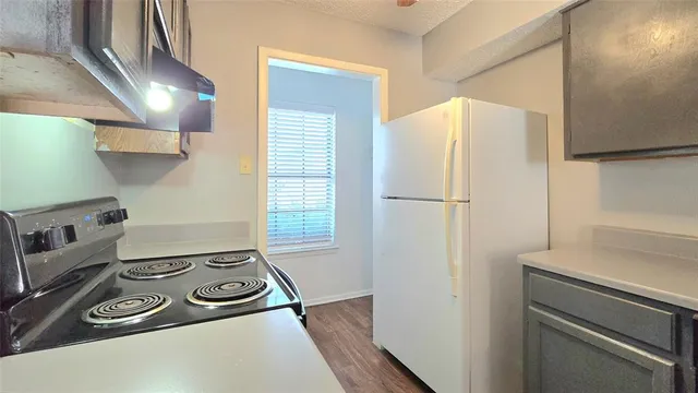 a kitchen with appliances and cabinets
