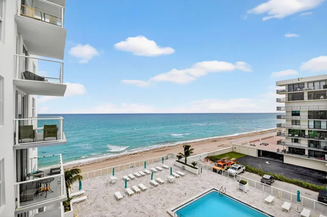 a bathroom with a granite countertop sink mirror and toilet