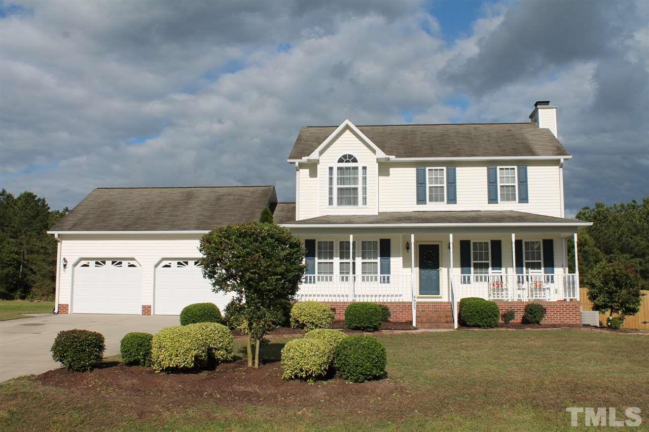 4825 Topstone Road Raleigh, NC 27603 - Photo 22 of 22 a front view of a house with a garden and plants