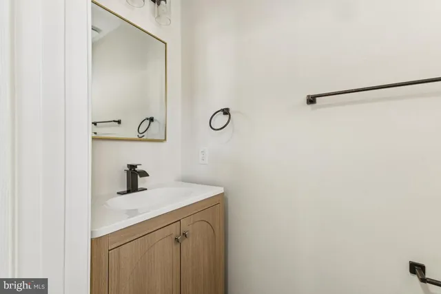 a bathroom with a sink and mirror