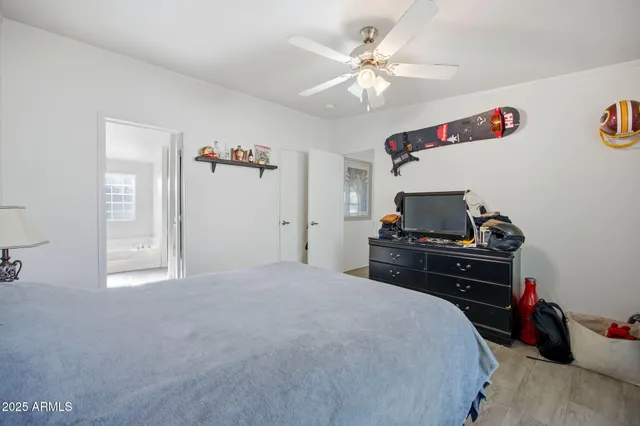 a bedroom with a bed and a tv