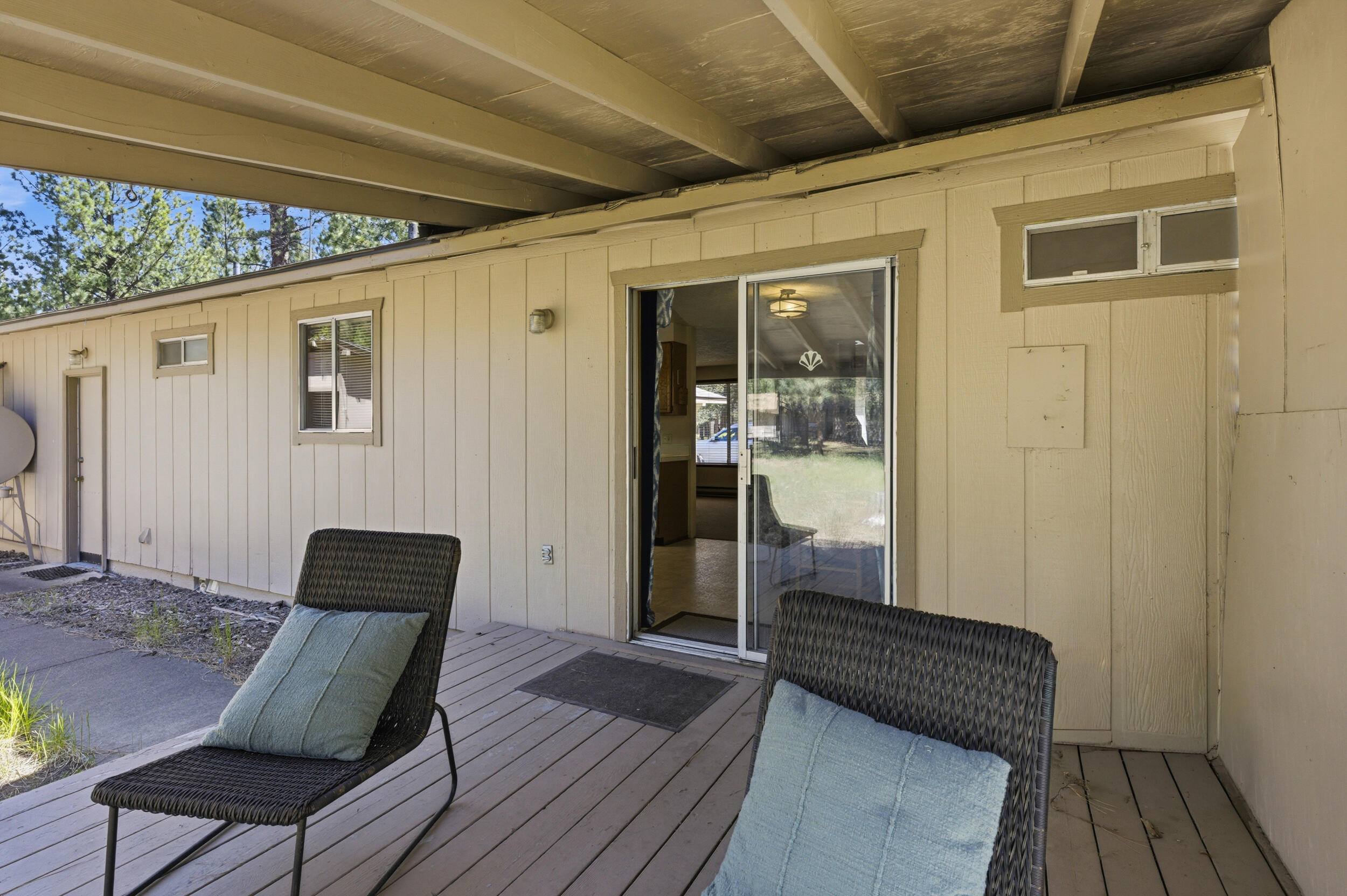 50868 Doe Loop La Pine, OR 97739 - Photo 32 of 51 a front view of a house with wooden floor and bench