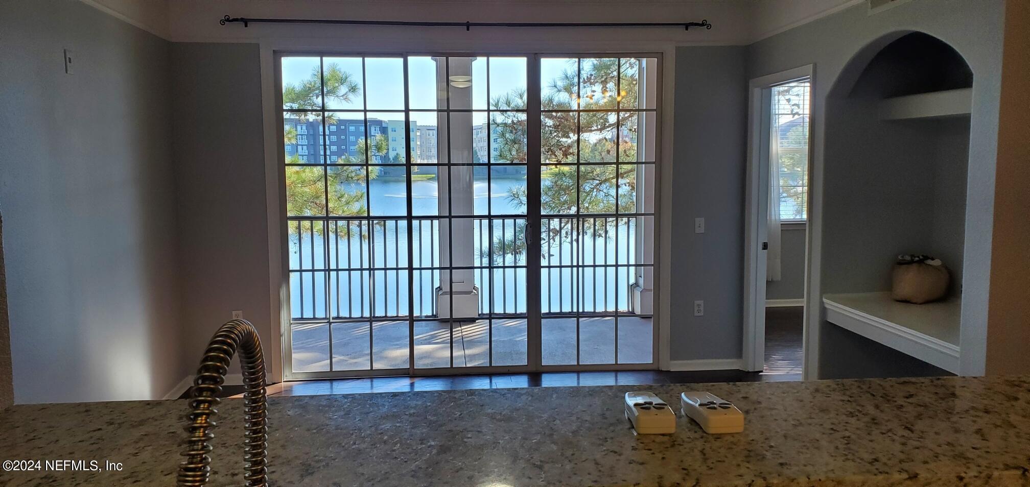 8550 Touchton Road, Unit 1126 Jacksonville, FL 32216 - Photo 6 of 24 lake view from living and kitchen