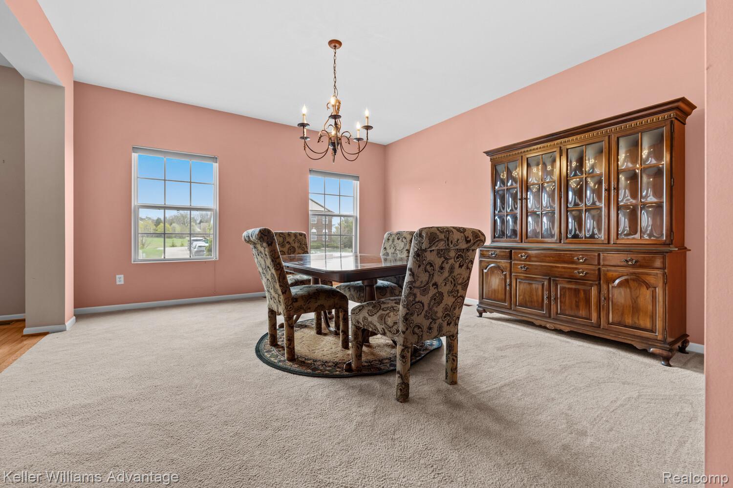 4100 Norwich Court Rochester, MI 48306 - Photo 24 of 72 Dining space featuring hanging lights and light carpet