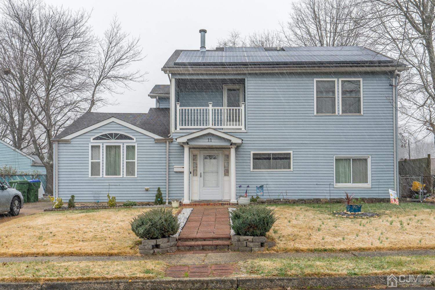 11 Baxter Road Edison, NJ 08817 - Photo 1 of 24 a front view of a house with garden