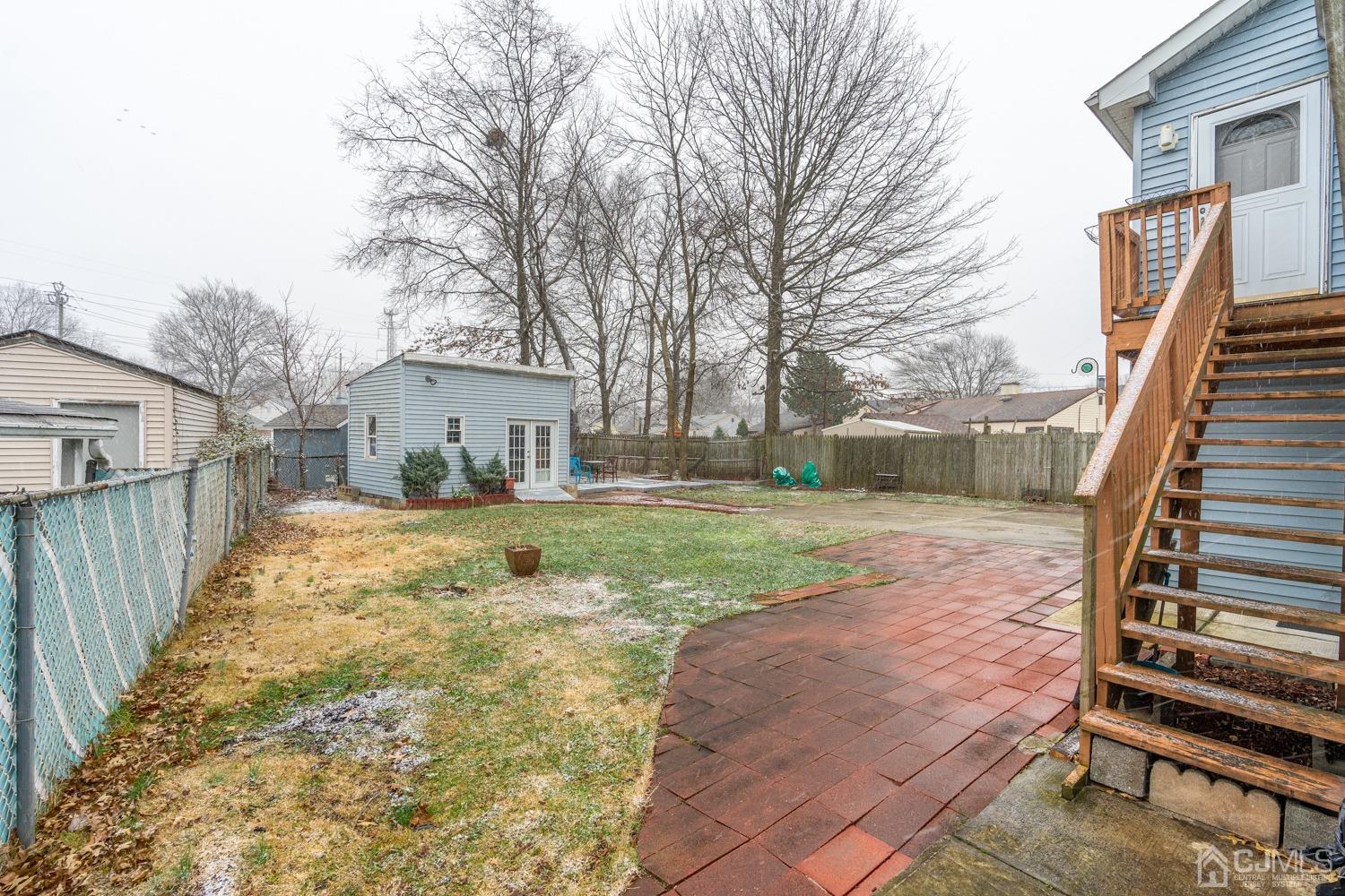 11 Baxter Road Edison, NJ 08817 - Photo 23 of 24 a view of a house with backyard and trees