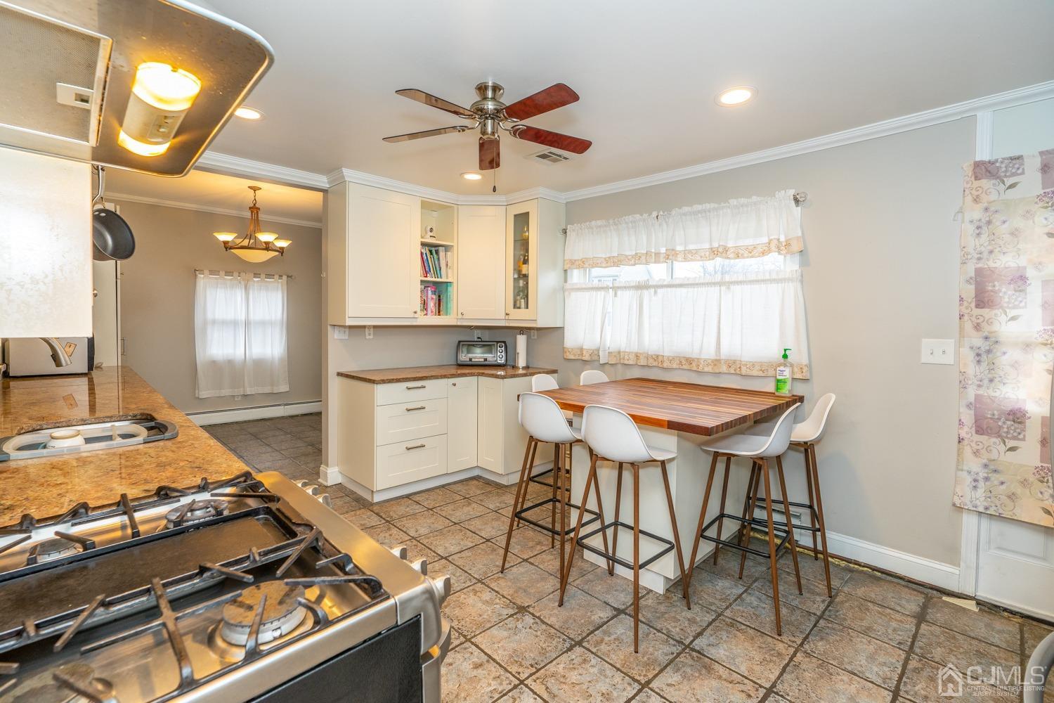 11 Baxter Road Edison, NJ 08817 - Photo 6 of 24 a kitchen with a table and chairs in it