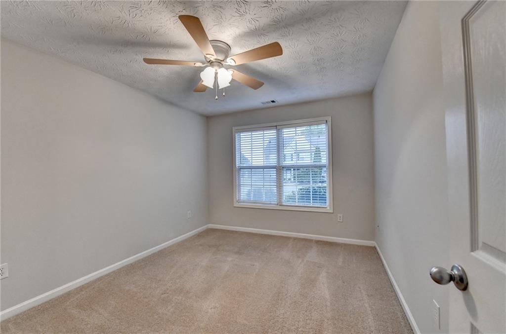 310 Andrew Ridge Drive Jefferson, GA 30549 - Photo 40 of 52 an empty room with windows and fan