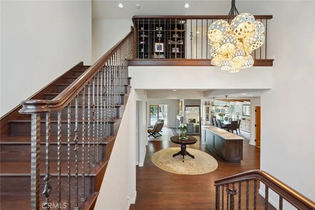 a dining room with furniture and chandelier